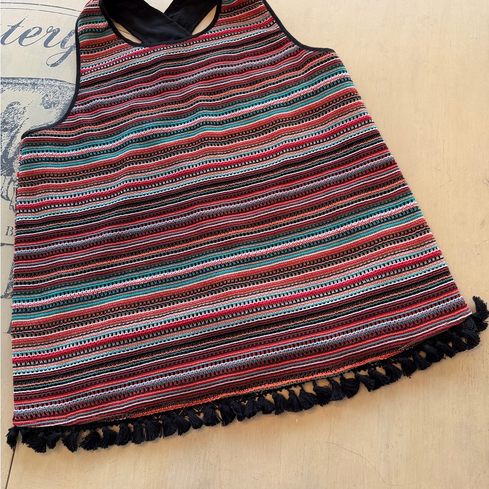 Colorful faux crocheted tank w Tassel hem, criss cross back w peep hole. Lined